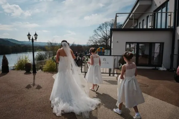 A bride arriving at Casa beside the water